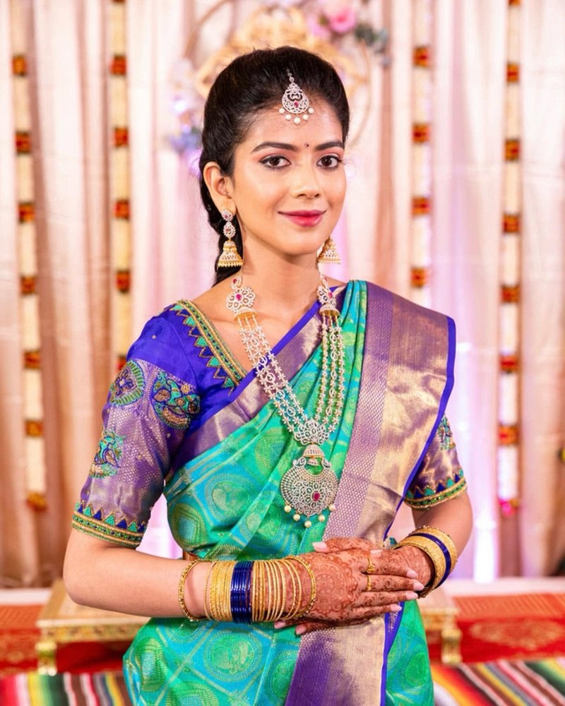 Bridal saree makeup with statement jewelry